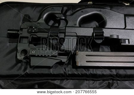 Close up a black BB Gun with a magazine in the case.