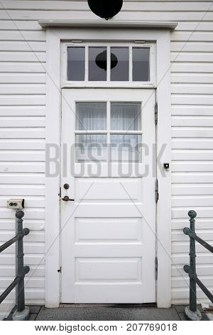 Door on a wooden white house in Iceland