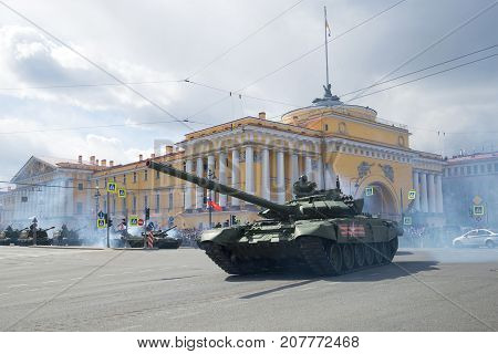 ST PETERSBURG, RUSSIA - MAY 09, 2017: Russian T-72B3 tank against the background of the Admiralty building. Fragment of the military parade in honor of the Victory Day