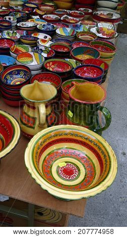 Andalusia Spain - August 15 2014: Large colourful collection of hand painted bowls