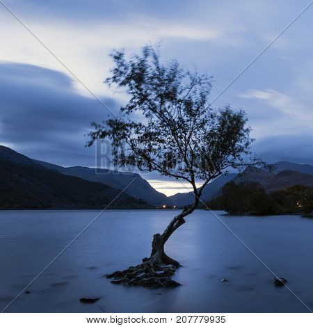 Beautiful Landscape Image Of Llyn Padarn At Sunrise In Autumn In Snowfonia National Park