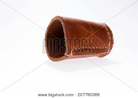 Brown leather dice cup isolated on white background