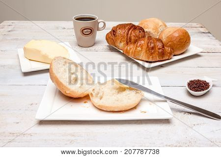 an Hard roll call it in Dutch Pistolee and croissant whit knife and butter
