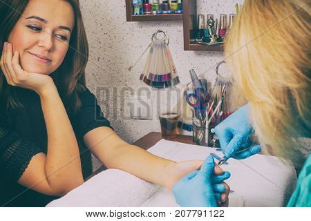 girl doing a manicure at the spa.