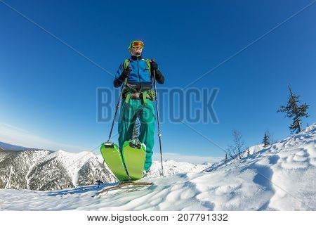 Man Skier Freerider Standing At Top Of Ridge, Adventure Winter Freeride Extreme Sport