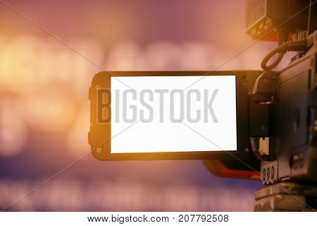 Blur of Video camera or camcorder operator working for record couple speaker or Presenterson stage in conference and convention hall in Vietnam blak white screen on recording