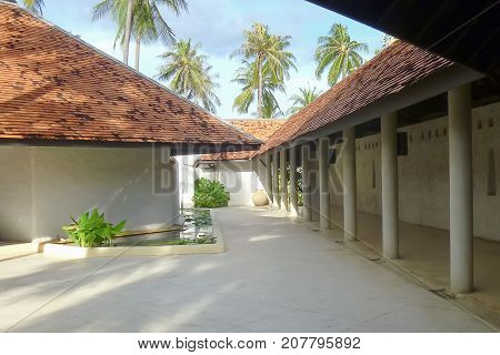 The Beautiful view of space and lightshade and shadowthe row of column with the minimal style and design of peaceful tropical architecture.