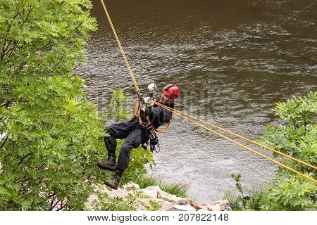 Kadan Czech Republic June 6 2012: Exercise rescue units. Training rescue people in inaccessible terrain at the dam Kadan. Recovery using rope techniques