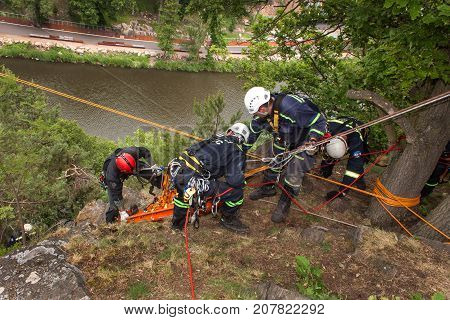 Kadan Czech Republic June 6 2012: Exercise rescue units. Training rescue people in inaccessible terrain at the dam Kadan. Recovery using rope techniques