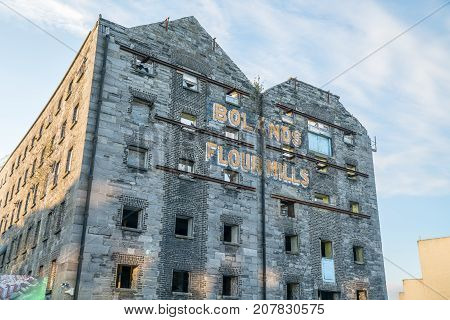 DUBLIN IRELAND - AUGUST 9 2017; Old building shell with original industrial signage Bolands Flour Mills in process of redevelopment in to city apartments.