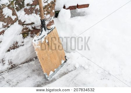 Snow shovel. Ended heavy snowfall. Snow removal.