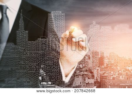 Businessman drawing abstract circuit board city. Tech concept. Double exposure