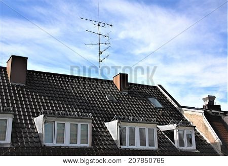 Roof top with chimney windows and antenna