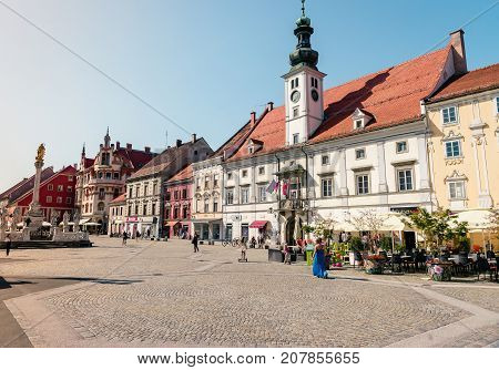 MARIBOR, SLOVENIA - AUGUST 24, 2017: Main square and plague column at Main Square of the city of Maribor in Slovenia, Europe. Historical religious sculpture
