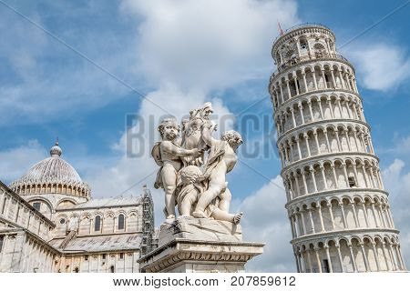 PISA, ITALY - SEPTEMBER 20, 2014: The world famous Piazza dei Miracoli in Pisa, Tuscany. The construction of the cathedral was begun in 1064.