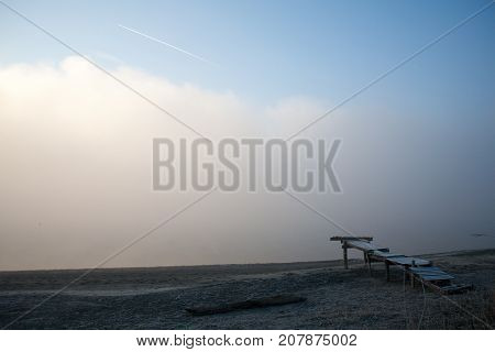 Morning on the river early morning reeds mist fog and water surface on the river