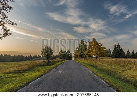 Color evening with road in Slavkovsky les national park in autumn time