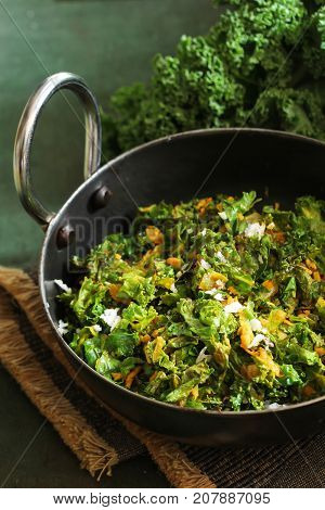 Kale leaves stir fried with Turmeric and coconut selective focus
