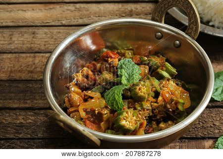 Bhindi Masala or Fry / Okra cooked with onions tomatoes and spices selective focus