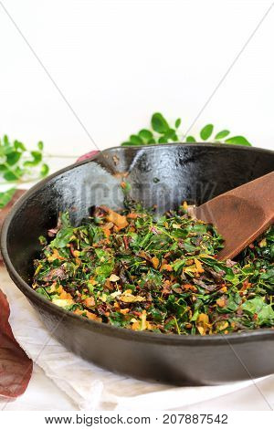 Moringa red Spinach stir fry/ Cheera Drumstick leaves Thoran selective focus