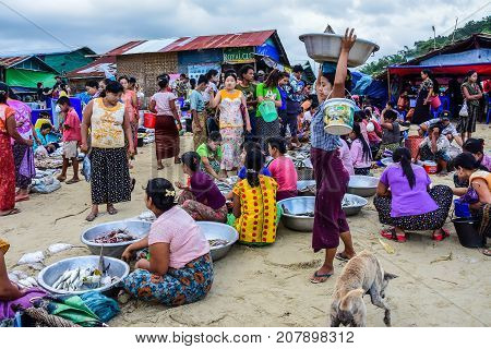 Dawei Myanmar - July 12 2015: Fresh market where sellers and buyers meet to sell and buy fresh and raw food in Dawei Myanmar