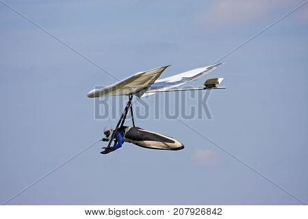 Hang Glider flying in a blue sky