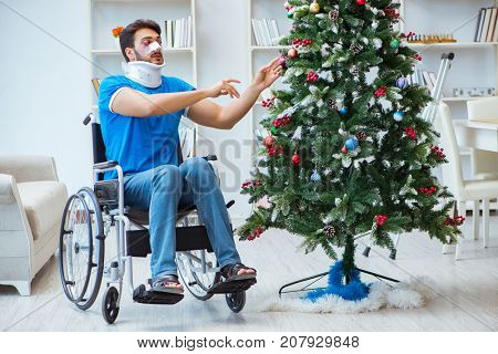 Injured disabled man celebrating christmas at home