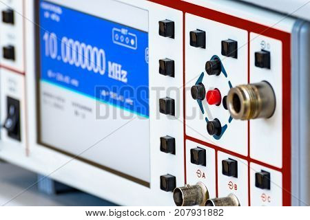 Fragment of a modern digital oscilloscope. Scientific measuring equipment. Abstract industrial background.