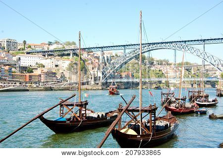 31 may 2013-oporto-portugal-old boats carrying oporto wine along the douro river