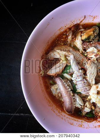 Noodles Seefood Tom Yum With Squid And Mantis Shrimp, Squid, Prawn In A Bowl On Wooden Table, Still