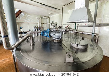 Stainless steel tanks for mixing liquid. Equipment for mixing sugar and yeast mixture.