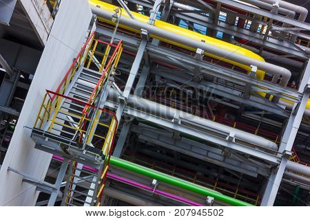 The different colored pipes in the installation of a petrochemical plant