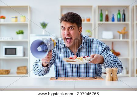 Husband with loudspeaker yelling at his wife