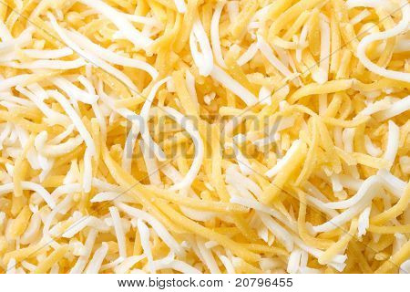Strimlet monterey jack og cheddar ost closeup baggrund