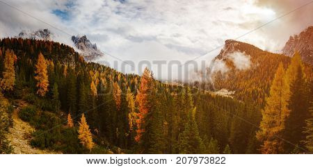 Stunning image of the alpine wallpaper. Dramatic scene, gloomy weather. Location famous place National Park Tre Cime di Lavaredo, Misurina, Dolomiti alps, South Tyrol, Italy, Europe. Beauty world.