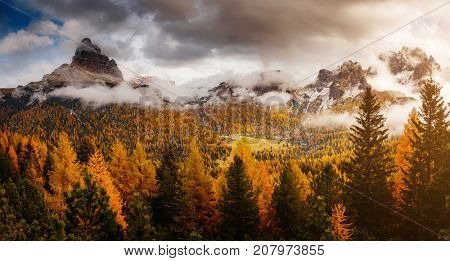 Stunning image of the alpine wallpaper. Dramatic scene, gloomy weather. Location famous place National Park Tre Cime di Lavaredo, Misurina, Dolomiti alps, South Tyrol, Italy, Europe. Beauty world.