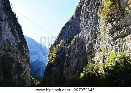 The road goes through the gorge of the Caucasus mountains