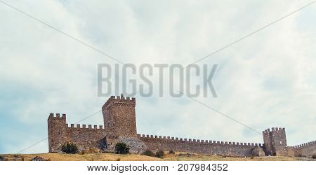 Genoese fortress in Sudak, the Crimea Peninsula, Black sea. Consular castle and the fortification wall of the upper tier. Part of the wall, Museum-reserve 