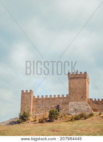 Genoese fortress in Sudak, the Crimea Peninsula, Black sea. Consular castle and the fortification wall of the upper tier. Part of the wall, Museum-reserve 