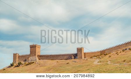 Genoese fortress in Sudak, the Crimea Peninsula, Black sea. Consular castle and the fortification wall of the upper tier. Part of the wall, Museum-reserve 