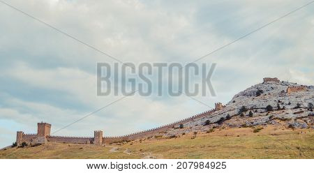 Genoese fortress in Sudak, the Crimea Peninsula, Black sea. Consular castle and the fortification wall of the upper tier. Part of the wall, Museum-reserve 