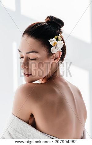 Young Woman With Lily In Hair