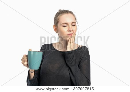 A Woman Drinks Hot Coffee And Is Sensitive To Heat