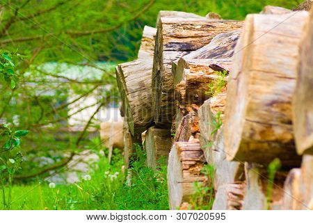 Stack Of Wooden Pillars Stacked On Top Of The Other