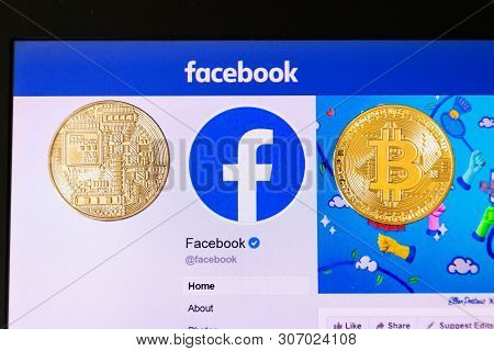 Prague, Czech Republic - June 18 2019: Golden Bitcoin Lying Homepage Of Facebook Launching Digital W
