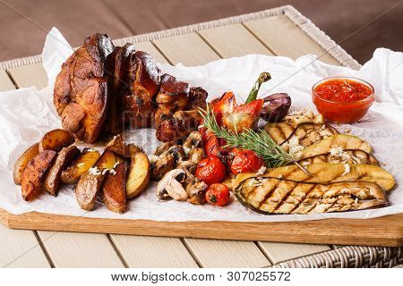 Grilled Pork Knuckle With Grilled Tomatoes, Champignons, Vagetable Marrow, Eggplant, Red Sweet Peppe