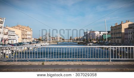 Street Atmosphere On The Stone Bridge Near The Marina Of Sete, France