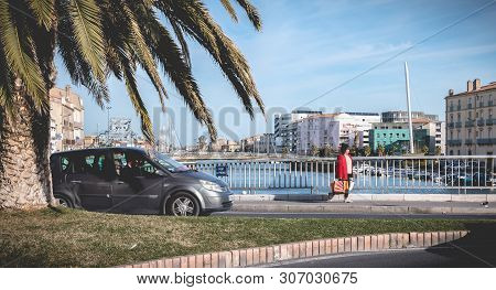 Street Atmosphere On The Stone Bridge Near The Marina Of Sete, France