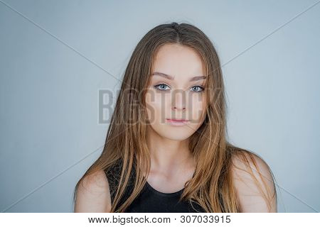 Woman Portrait Natural Beautiful. Portrait Of A Beautiful Girl In Studio. Posing For University Phot