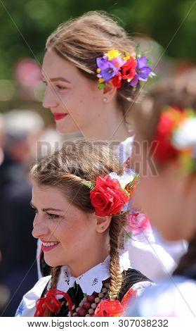 Lowicz / Poland - June 15 2017: Pretty Polish Girls With Head Decorated With Flowers And Colorful Ri